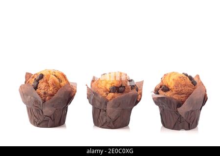Three chocolate muffins isolated on a white background with copyspace. Stock Photo