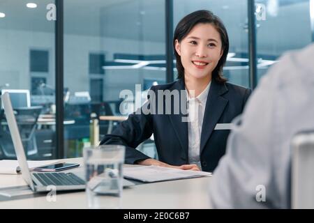 Sales staff with clients Stock Photo