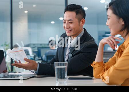 Sales staff with clients Stock Photo