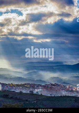 Stunning overview of  Guadalupe village during a foggy sunrise, Caceres, Spain Stock Photo