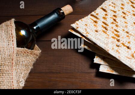 traditional Jewish kosher matzo for Easter pesah on a wooden table. Jewish Easter food Stock Photo