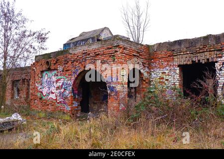 Old abandoned military station brick ruin building with graffiti in Budapest suburb, Hungary Stock Photo