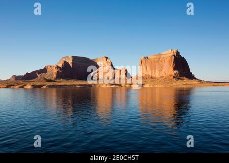 Sandstone cliffs reflected in the tranquil waters of Lake Powell, Glen Canyon National Recreation Area, Utah, United States of America Stock Photo