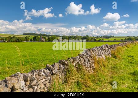 View of village church and dry stone walls, Biggin, Peak District National Park, Derbyshire, England, United Kingdom, Europe Stock Photo