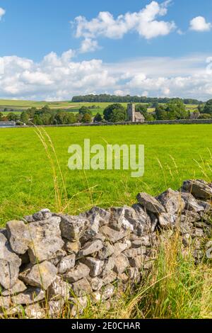 View of village church and dry stone walls, Biggin, Peak District National Park, Derbyshire, England, United Kingdom, Europe Stock Photo