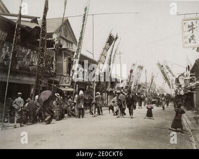 19th century vintage photograph - Isezakicho, Yokohama, Japan. Now a high-energy shopping district Isezakicho centers on Isezaki Mall, an outdoor pedestrian arcade with mainstream boutiques and department stores. Image c.1880's. Stock Photo