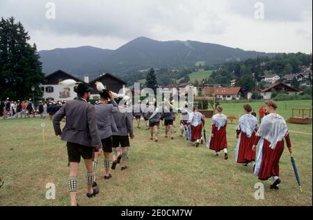 Germany /Bavaria / Bavarian festival in Garmisch Partenkirchen / Woman and Man wearing traditional clothes like Lederhose and Dirndl . Stock Photo