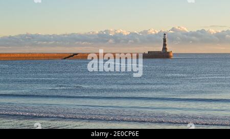 Early morning golden light hits the Roker Pier and Lighthouse near Sunderland, Tyne and Wear, North-East England. Stock Photo