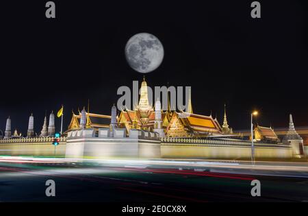 The Temple of the Emerald Buddha or Wat Phra Kaeo with full moon on night,It is an important landmark of Bangkok