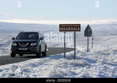 Teesdale, County Durham, UK. 31st December 2020. UK Weather.  The landscape of Upper Teesdale in the North Pennines became a beautiful winter wonderland of powder blue skies, ice and snow on the final day of 2020. Credit: David Forster/Alamy Live News Stock Photo