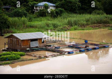 View landscape water flowing and fish cage of thai people fishery in Sakae Krang river at Uthaithani city town in Uthai Thani Province of Thailand Stock Photo