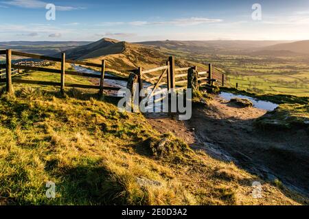A colourful sunrise at the famous gate on Mam Tor in the Peak District National Park, Derbyshire, England Stock Photo