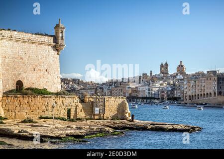 Fort St Angelo and other historic waterfront buildings on Grand Harbour waterside, Valletta, Malta. Stock Photo