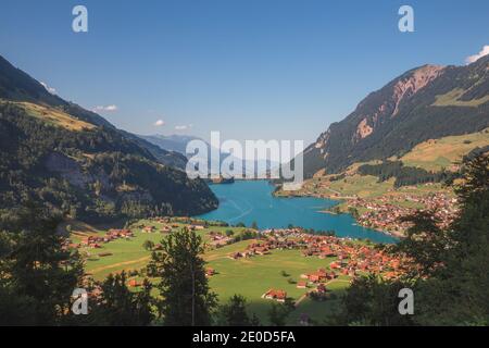 A view over the beautiful Lake Lungern (Lungerersee) on a clear sunny day taken from Schoenbuehel viewing point. Stock Photo