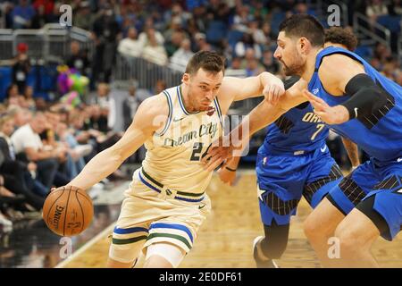 Milwaukee Bucks player Pat Connaughton #24 attempt to rush pass Magic's Nikola Vucevic #9 at the Amway in Orlando Florida on Saturday February 8, 2020.  Photo Credit:  Marty Jean-Louis Stock Photo