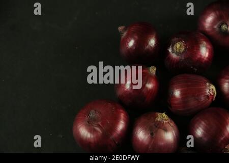 sweet red onions on background Stock Photo