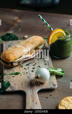 Healthy sandwich of roast beef with vegan smoothie Stock Photo