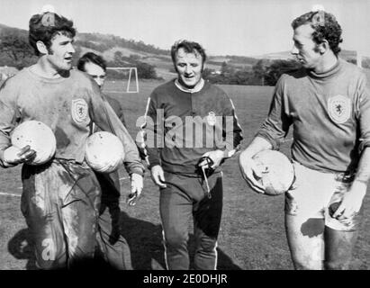 File photo dated 11/10/71 of then Scotland goalkeeper Bobby Clarke, then new team manager Tommy Docherty and then Arsenal goalkeeper Bob Wilson training for a match against Portugal at Hampden Park. Mr Docherty has died at the age of 92 following a long illness. Stock Photo