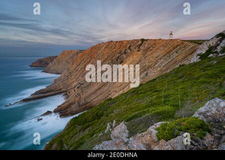 Cabo Espichel cape at sunset with sea cliffs and atlantic ocean landscape, in Portugal Stock Photo