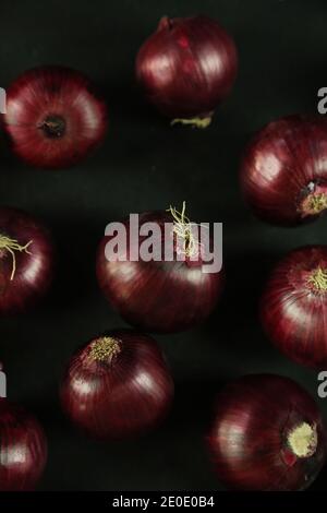 sweet red onions on background Stock Photo