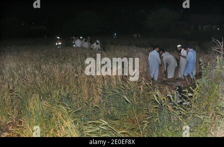 Resque and local peoples search bodies after a passenger plane of Bhoja Airline crashed near Lohi Bhair at Hussainabad village about 7 kms away from Benazir Bhutto International Airport in Islamabad, on April 20,2012, Pakistan. Plane carrying 118 passengers flying from Karachi to Islamabad.Photo by Photo by Irfan Ali/ABACAPRESS.COM Stock Photo