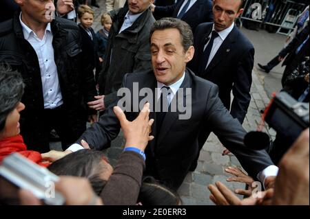 France's incumbent President and right-wing ruling party Union for a Popular Movement (UMP) candidate for the French 2012 presidential election Nicolas Sarkozy leaves a polling station in Paris, France on May 6, 2012 as part of the 2012 French presidential election second round vote. Photo by Christophe Guibbaud/ABACAPRESS.COM Stock Photo