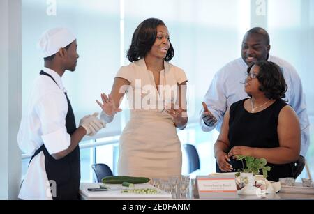 First Lady Michelle Obama reacts as after tasting food that students make for the lunch with the NATO leaders Spouses at the Gary Corner Youth Center in Chicago, Illinois, IL, US on May 20, 2012. Photo by Olivier Douliery/ABACAPRESS.COM Stock Photo