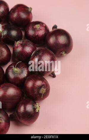 sweet red onions on background Stock Photo