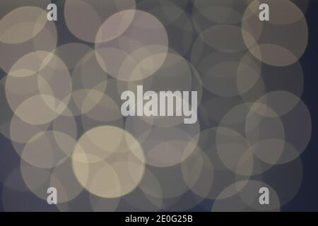 Blurred white lights on blue background. Large circles Stock Photo