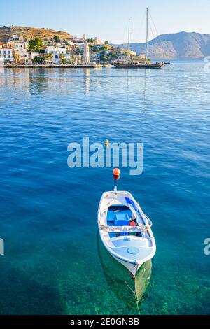 Small blue boat in Yialos harbour, Symi Island, Dodecanese, Greece Stock Photo