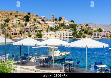 Waterfront views towards the pretty area of Harani on Symi Island, Greece Stock Photo