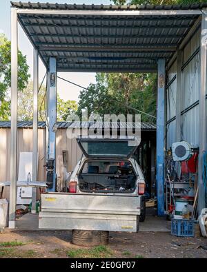 Townsville, Queensland, Australia - December 2020: An old station wagon car parked in a shed and under repair Stock Photo