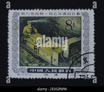 KHARKIV / UKRAINE - SEPTEMBER 3, 2020: Vintage stamp printed by People's Republic of China, a factory worker, circa 1955 Stock Photo