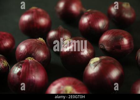sweet red onions on background Stock Photo