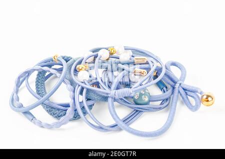 Set of blue fabric rubber bands. Elastic hair ties in vibrant colors on white background. Stock Photo