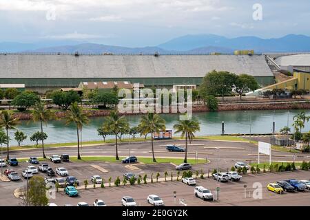 Townsville, Queensland, Australia - December 2020: Looking down onto a hotel car park with industrial sheds on the other side of the river Stock Photo