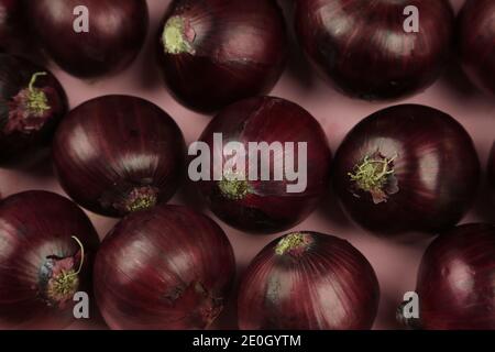 sweet red onions on background Stock Photo