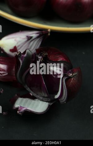 sweet red onions on background Stock Photo