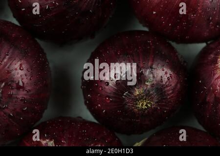 sweet red onions on background Stock Photo