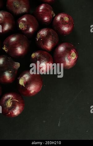 sweet red onions on background Stock Photo