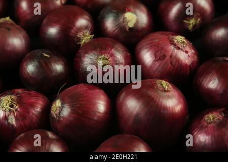 sweet red onions on background Stock Photo