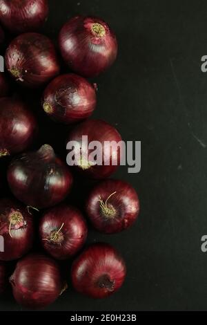 sweet red onions on background Stock Photo