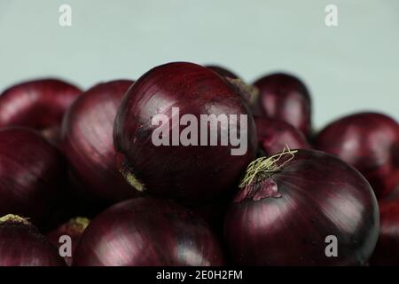 sweet red onions on background Stock Photo