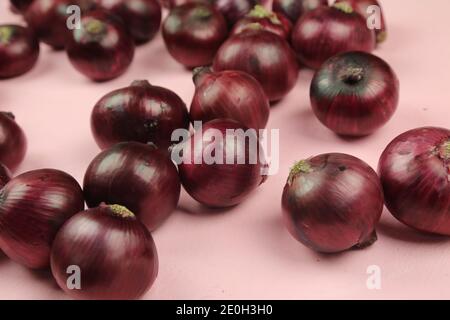 sweet red onions on background Stock Photo