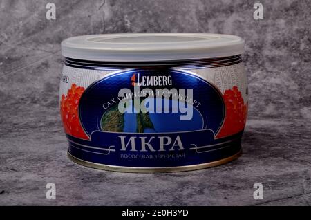 RIGA, LATVIA - december 31, 2020: Red Lemberg Caviar  in closed metal tin on gray stone background, Red Russian caviar, iron can with red salmon cavia Stock Photo