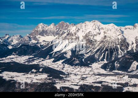 Scheichenspitze Mountain Peak in the Dachstein Mountain Range or Massif and the Village of Ramsau am Dachstein from Above in Winter with a Snow Covere Stock Photo