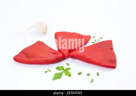 Roasted piquillo peppers with garlic, parsley and chives isolated on  white background. Stock Photo