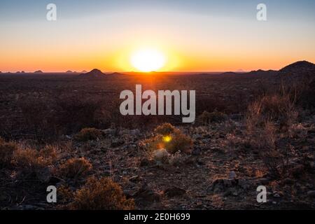 Sunset in the Savanna in Omaruru in the Erongo Region on the Central Plateau of Namibia, Africa, a Scenic Sundown in the African Wilderness Stock Photo