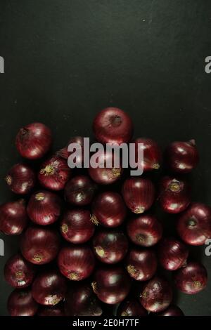 sweet red onions on background Stock Photo