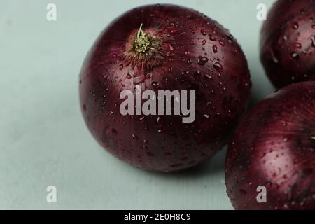 sweet red onions on background Stock Photo